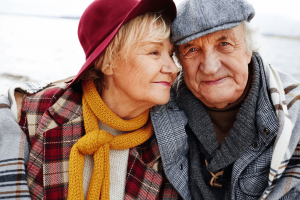 couple smiling wearing hats