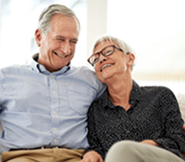 couple hugging on couch