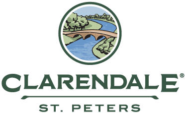 Logo of Clarendale St. Peters featuring a bridge over a river with trees in the background.