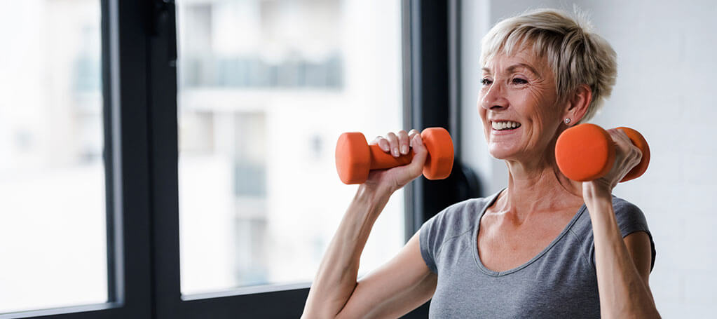 senior woman lifting weights