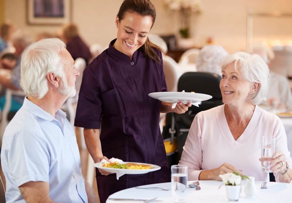 Senior couple enjoying dinner with great service